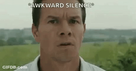 A Close Up Of A Man 'S Face With The Words `` Awkward Silence '' Written On The Bottom . GIF