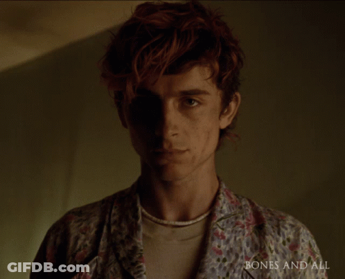 A Close Up Of A Man 'S Face With The Words Bones And All Visible GIF