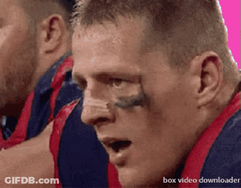 A Close Up Of A Man 'S Face With The Words Box Video Downloader Below GIF