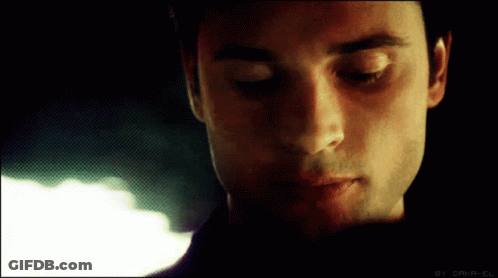 A Close Up Of A Man 'S Face With The Words " By Daka-El " On The Bottom GIF