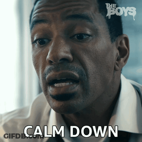 A Close Up Of A Man 'S Face With The Words Calm Down On The Bottom GIF