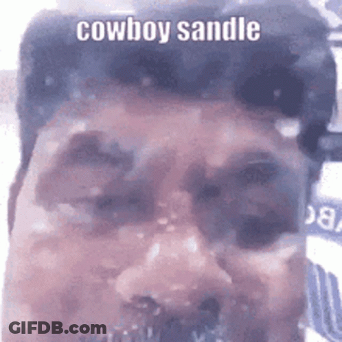 A Close Up Of A Man 'S Face With The Words Cowboy Sandle Written On It . GIF