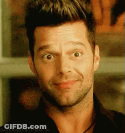 A Close Up Of A Man 'S Face With The Words Daily Dose Of Ricky Martin Below It GIF