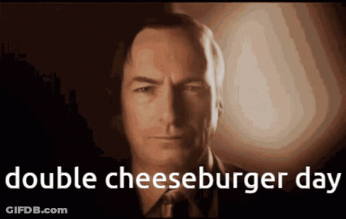A Close Up Of A Man 'S Face With The Words Double Cheeseburger Day Above Him GIF