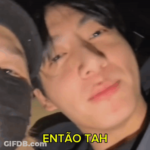 A Close Up Of A Man 'S Face With The Words Entao Tah Written Above Him GIF