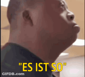 A Close Up Of A Man 'S Face With The Words " Es Ist So " On The Bottom GIF