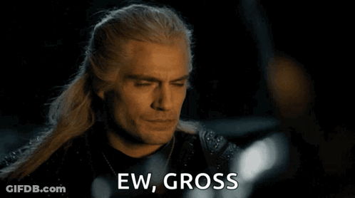 A Close Up Of A Man 'S Face With The Words Ew Gross Behind Him GIF