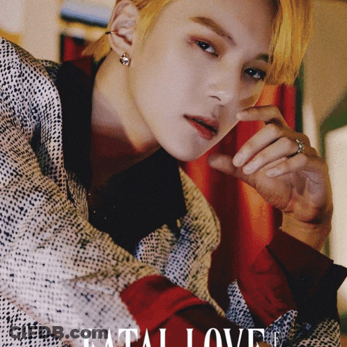 A Close Up Of A Man 'S Face With The Words " Fatal Love " On The Bottom GIF