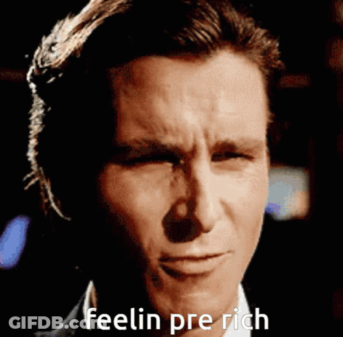 A Close Up Of A Man 'S Face With The Words Feelin Pre Rich Written Below It GIF