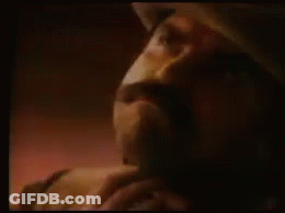 A Close Up Of A Man 'S Face With The Words Get A Rope Written Above Him . GIF