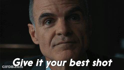A Close Up Of A Man 'S Face With The Words Give It Your Best Shot Below Him GIF
