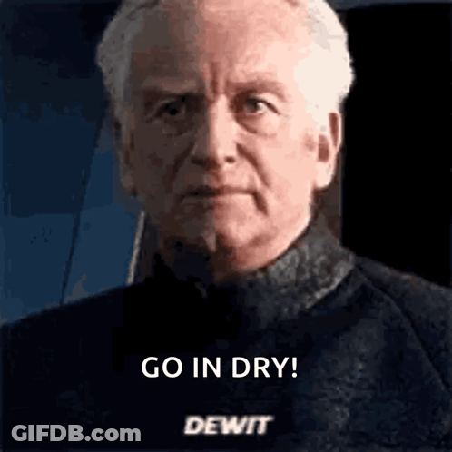 A Close Up Of A Man 'S Face With The Words `` Go In Dry Dewit '' Written On It . GIF