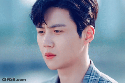 A Close Up Of A Man 'S Face With The Words Goldenwood Written Below It GIF