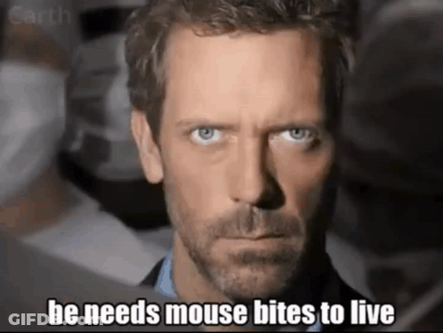 A Close Up Of A Man 'S Face With The Words He Needs Mouse Bites To Live GIF