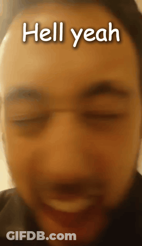 A Close Up Of A Man 'S Face With The Words Hell Yeah Written On It GIF