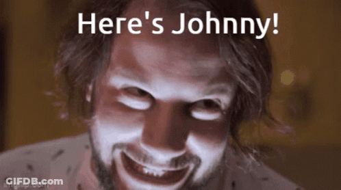 A Close Up Of A Man 'S Face With The Words Here 'S Johnny Above Him GIF