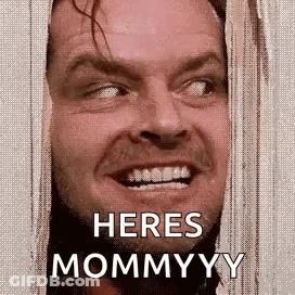 A Close Up Of A Man 'S Face With The Words `` Here 'S Mommyyy '' . GIF
