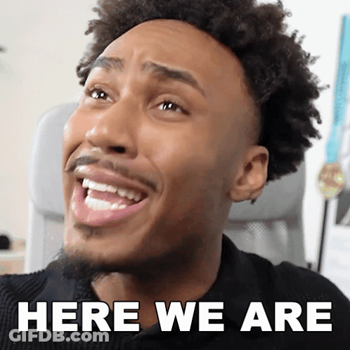A Close Up Of A Man 'S Face With The Words Here We Are Above Him GIF