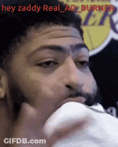 A Close Up Of A Man 'S Face With The Words Hey Zaddy Real Ad Burner GIF