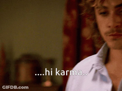 A Close Up Of A Man 'S Face With The Words Hi Karma Behind Him GIF