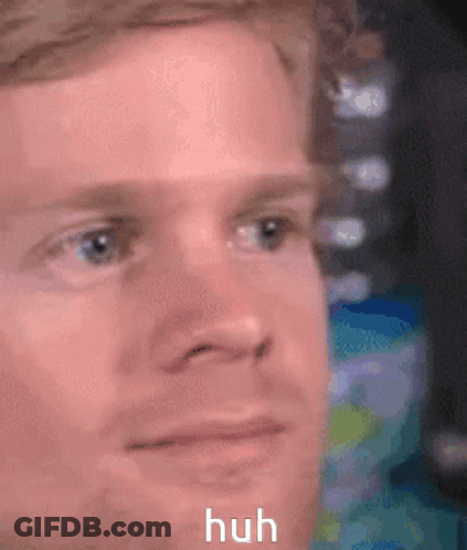 A Close Up Of A Man 'S Face With The Words Huh Written Below It . GIF