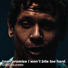 A Close Up Of A Man 'S Face With The Words " I Can Promise I Won 'T Bite Too Hard " GIF