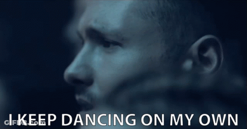 A Close Up Of A Man 'S Face With The Words I Keep Dancing On My Own Below Him GIF