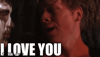 A Close Up Of A Man 'S Face With The Words I Love You Behind Him GIF
