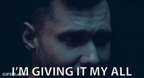 A Close Up Of A Man 'S Face With The Words I 'M Giving It My All Below Him GIF