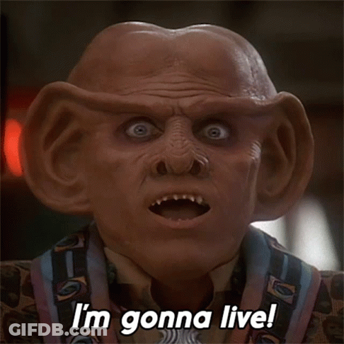 A Close Up Of A Man 'S Face With The Words I 'M Gonna Live GIF