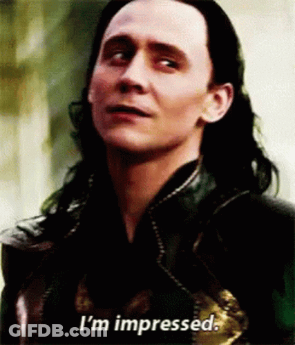 A Close Up Of A Man 'S Face With The Words `` I 'M Impressed '' Written On The Bottom . GIF