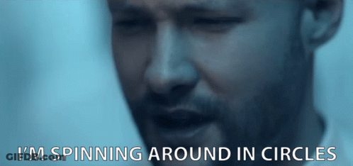 A Close Up Of A Man 'S Face With The Words I 'M Spinning Around In Circles Below It GIF