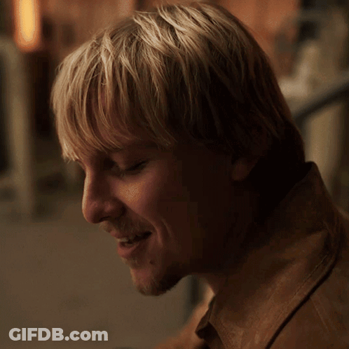A Close Up Of A Man 'S Face With The Words " I 'M Trying " Above Him GIF