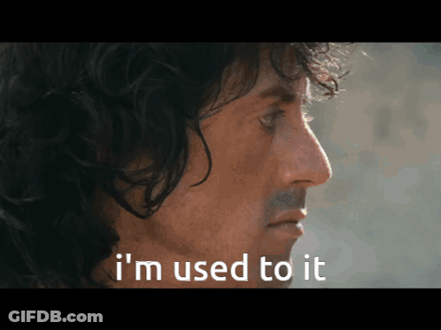 A Close Up Of A Man 'S Face With The Words " I 'M Used To It " Below Him GIF