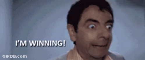 A Close Up Of A Man 'S Face With The Words `` I 'M Winning '' Behind Him . GIF