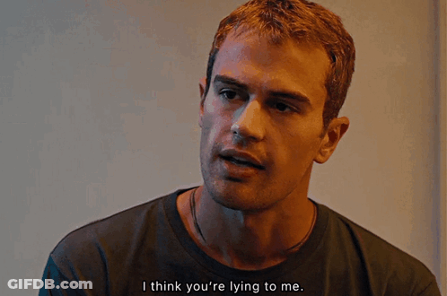 A Close Up Of A Man 'S Face With The Words I Think You 'Re Lying To Me GIF