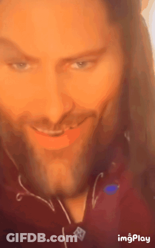 A Close Up Of A Man 'S Face With The Words Imgplay At The Bottom Right GIF