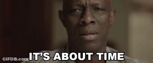 A Close Up Of A Man 'S Face With The Words `` It 'S About Time '' Written Above Him . GIF