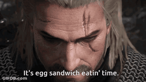 A Close Up Of A Man 'S Face With The Words " It 'S Egg Sandwich Eatin ' Time " Below Him GIF