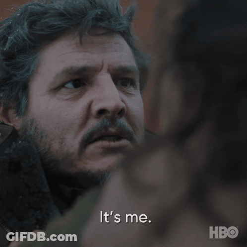 A Close Up Of A Man 'S Face With The Words It 'S Me Behind Him GIF