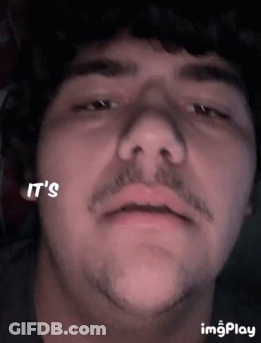 A Close Up Of A Man 'S Face With The Words It 'S Written On His Cheek GIF