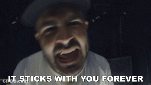 A Close Up Of A Man 'S Face With The Words It Sticks With You Forever Below It GIF