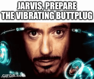 A Close Up Of A Man 'S Face With The Words `` Jarvis Prepare The Vibrating Buttplug '' Written On It . GIF