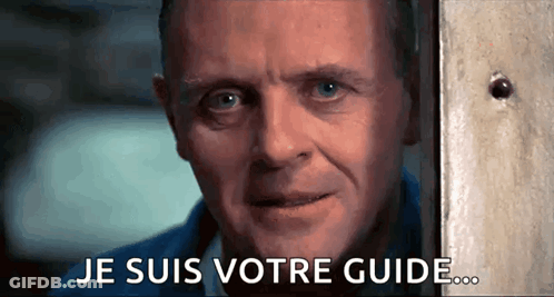 A Close Up Of A Man 'S Face With The Words Je Suis Votre Guide Written On The Bottom GIF