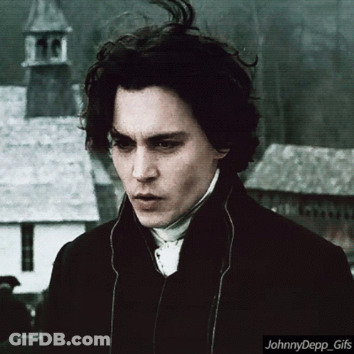 A Close Up Of A Man 'S Face With The Words Johnnydepp_gifs Below It GIF