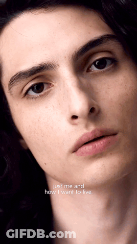 A Close Up Of A Man 'S Face With The Words Just Me And How I Want To Live Written Below It GIF