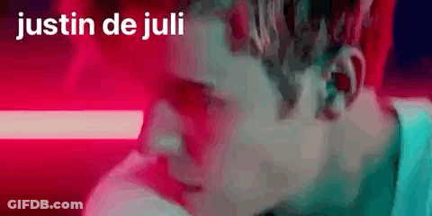 A Close Up Of A Man 'S Face With The Words Justin De Juli Written On The Bottom . GIF