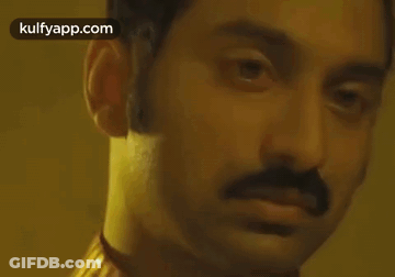 A Close Up Of A Man 'S Face With The Words Kulfyapp.com Visible GIF