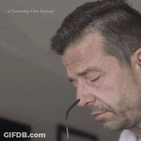 A Close Up Of A Man 'S Face With The Words La Guarimba Film Festival On The Bottom Right GIF