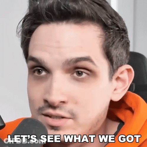 A Close Up Of A Man 'S Face With The Words Let 'S See What We Got Below Him GIF